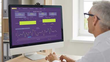Man at desktop computer using PSG's partner performance portal