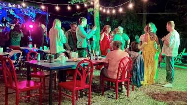 Night time summer crowd at outdoor bar