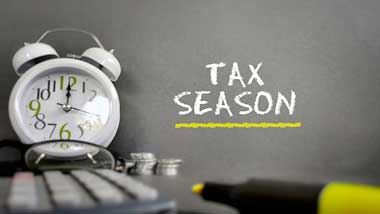 Image showing a clock and tax season. Prairie State Gaming blog post.